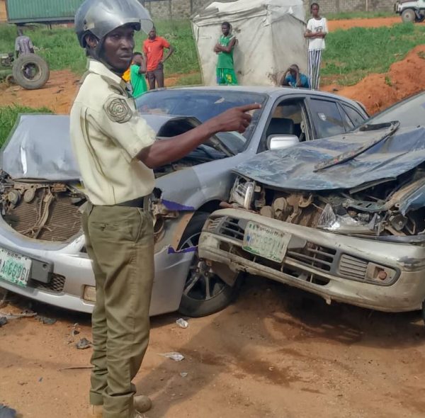A trace operative with some of the damaged vehicle